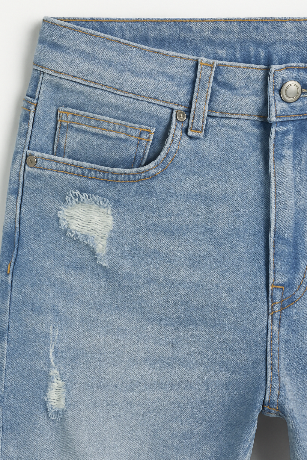 PANTALÓN JEAN SKINNY AZUL CLARO ROTOS CON BOTÓN PLATEADO